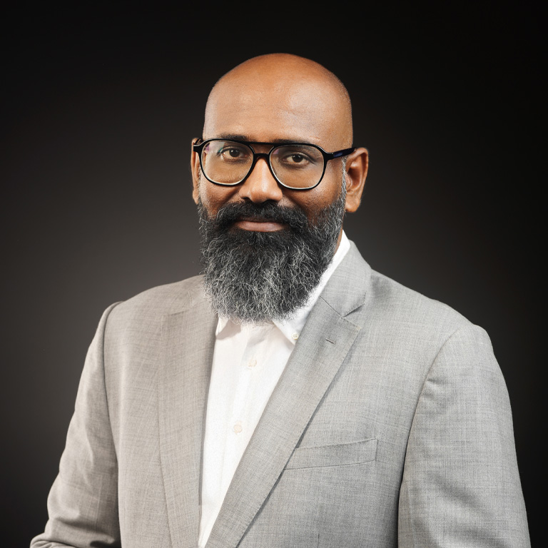 a man with a beard wearing glasses