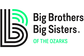 a white sign with black text and green circles